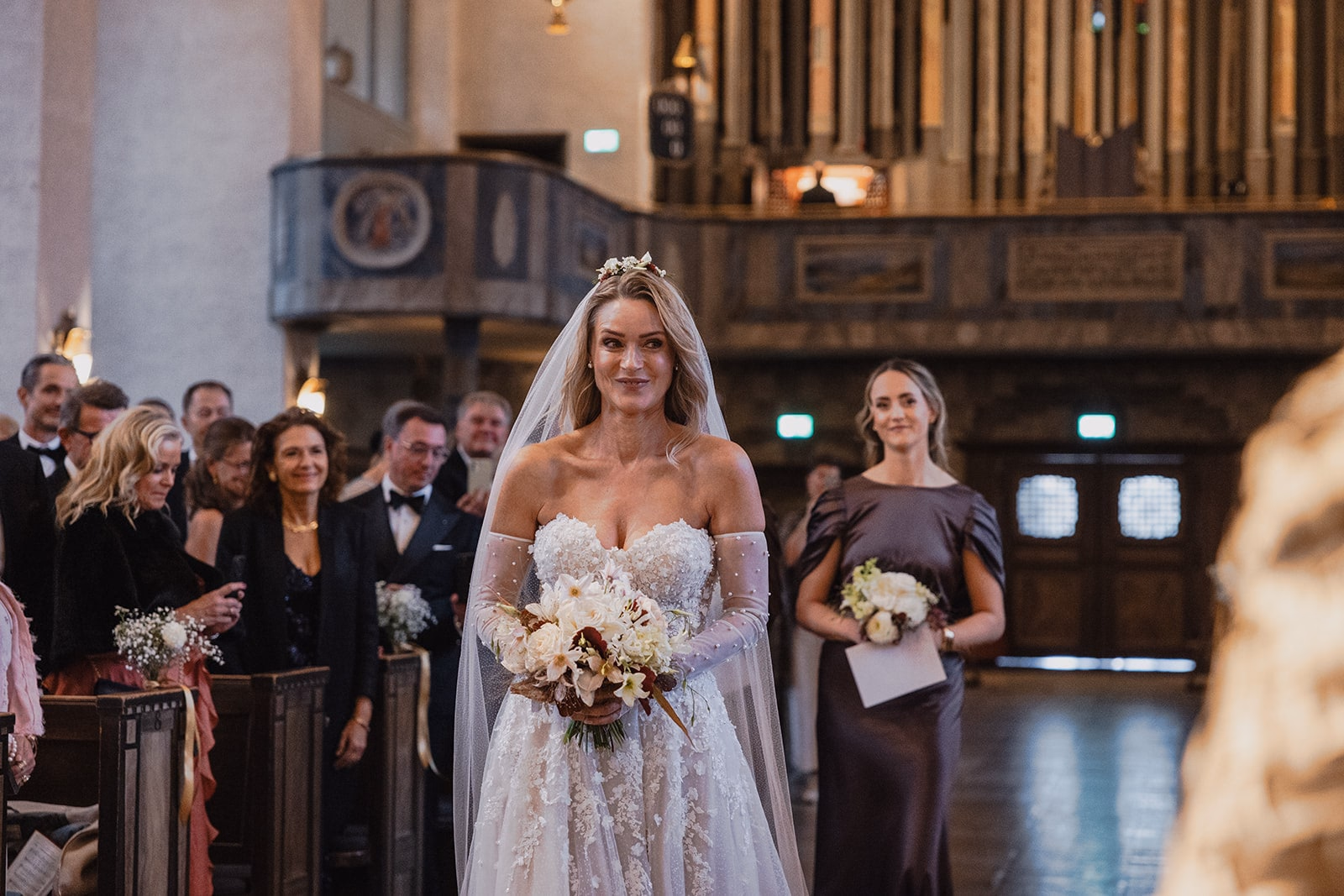 The bride arriving at the ceremony inside Högalidskyrkan.