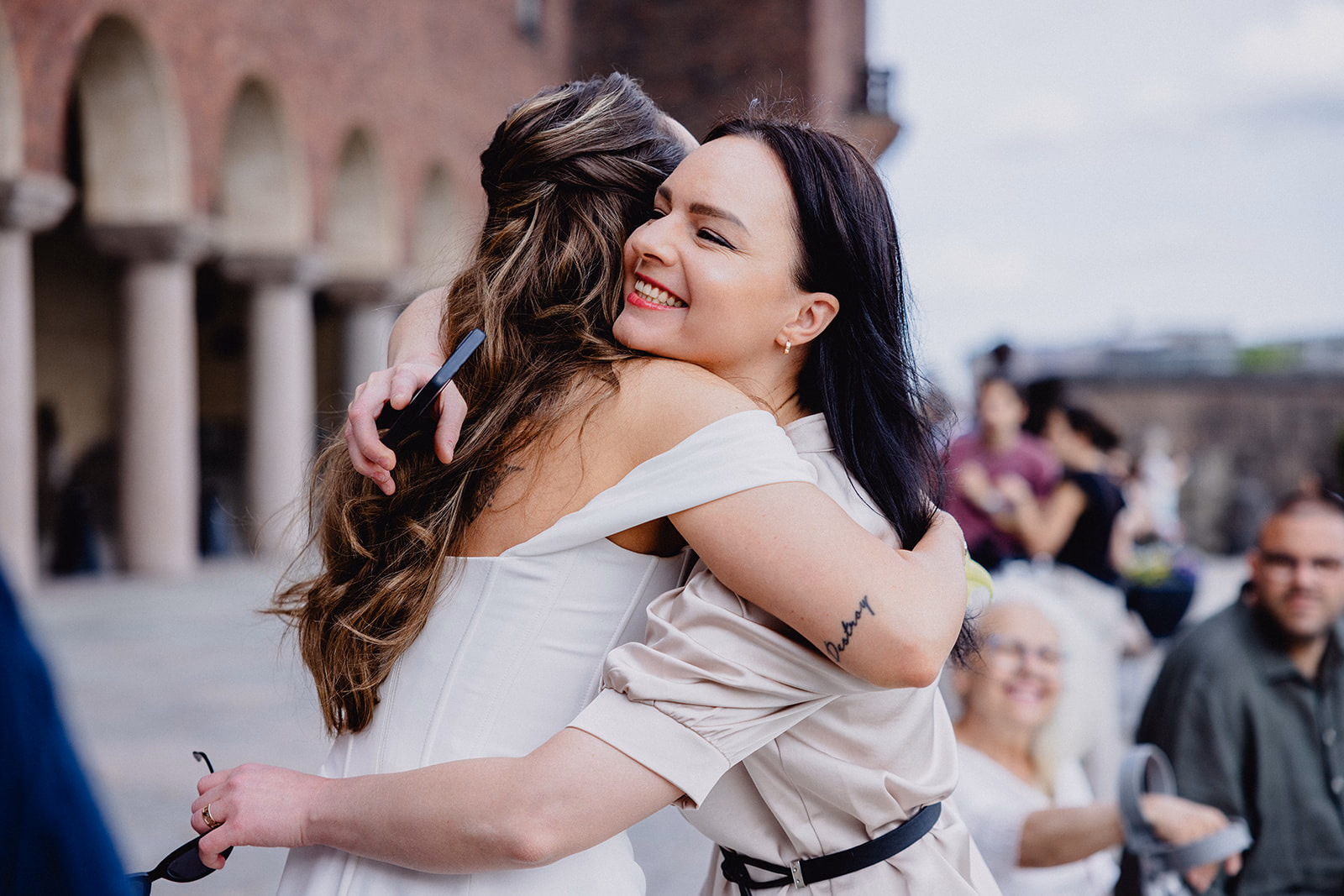 The bride greeting a wedding guest before the ceremony in Stockholm.