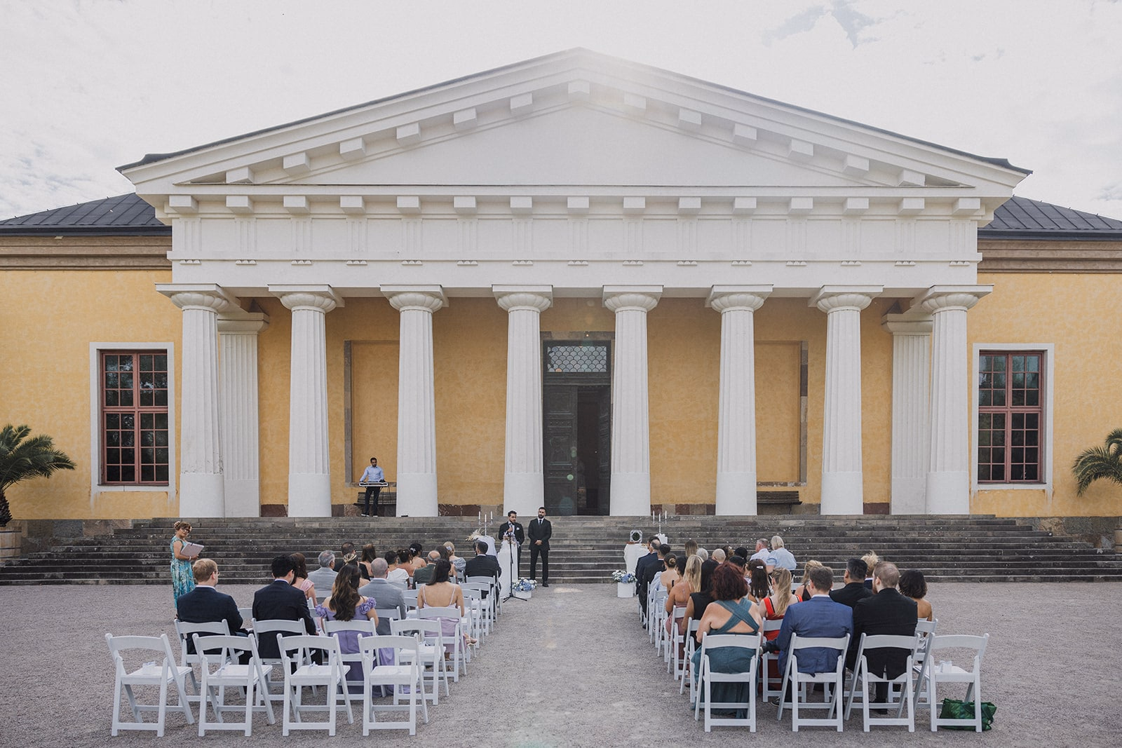Guests seated for the outdoor ceremony in front of the Linneanum.