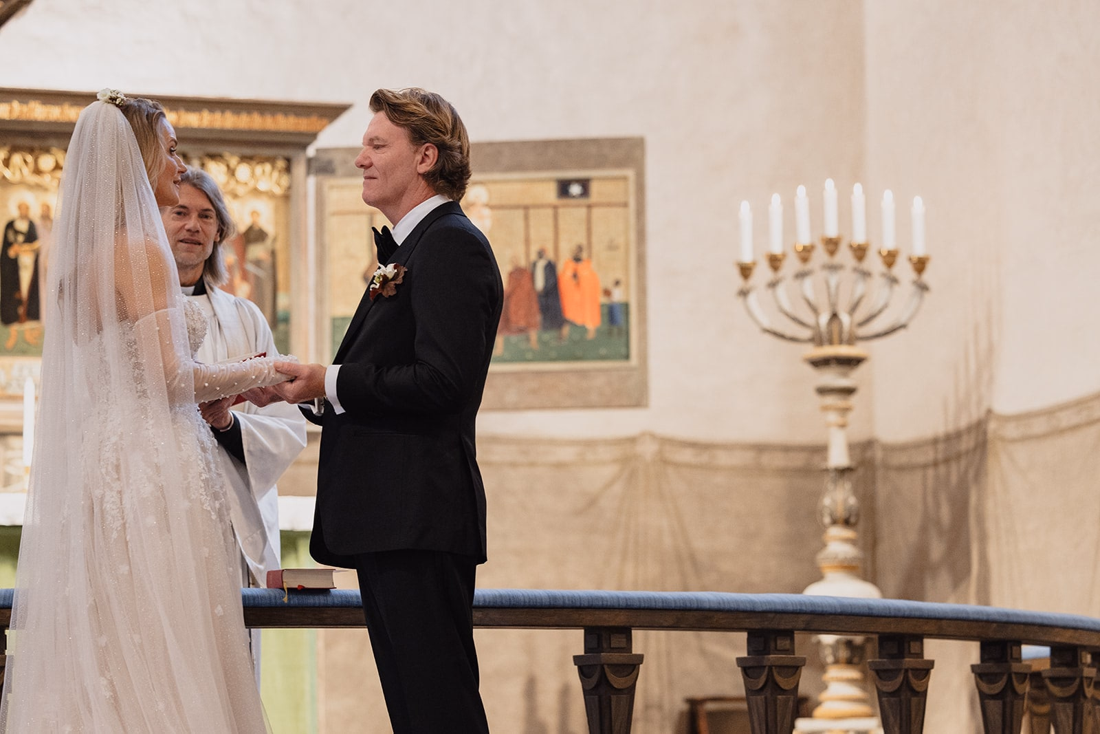 The groom reading his vows during the ceremony at Högalidskyrkan.