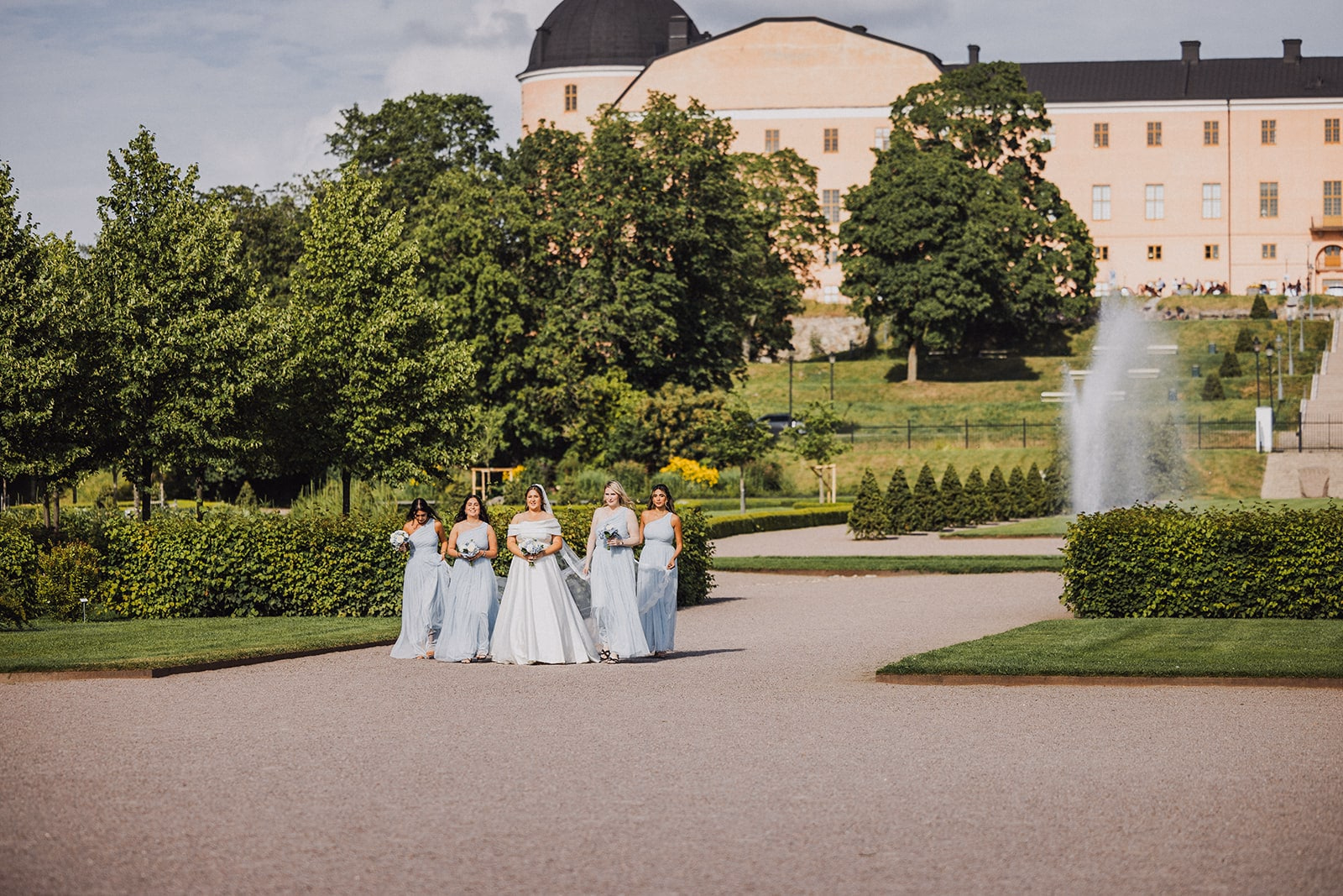 Members of the wedding party crossing the Botanical Garden.