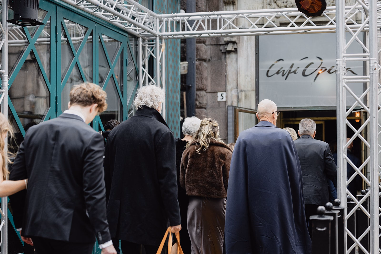 Wedding guests arriving at the entrance to Café Opera in Stockholm.