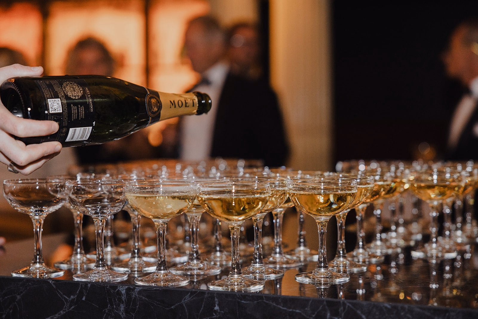 Champagne being poured for the wedding reception at Café Opera.