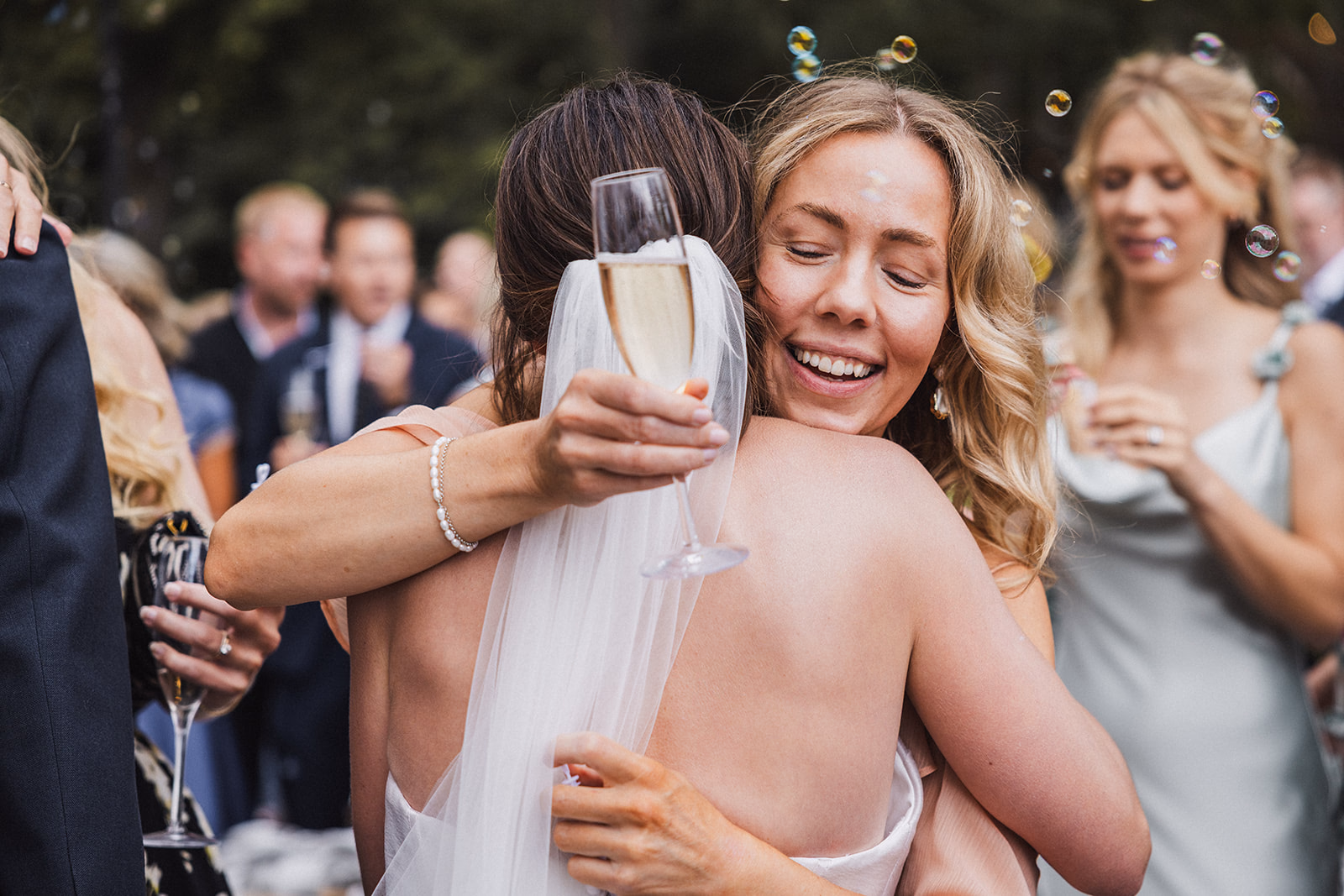The bride embracing a guest during the reception.