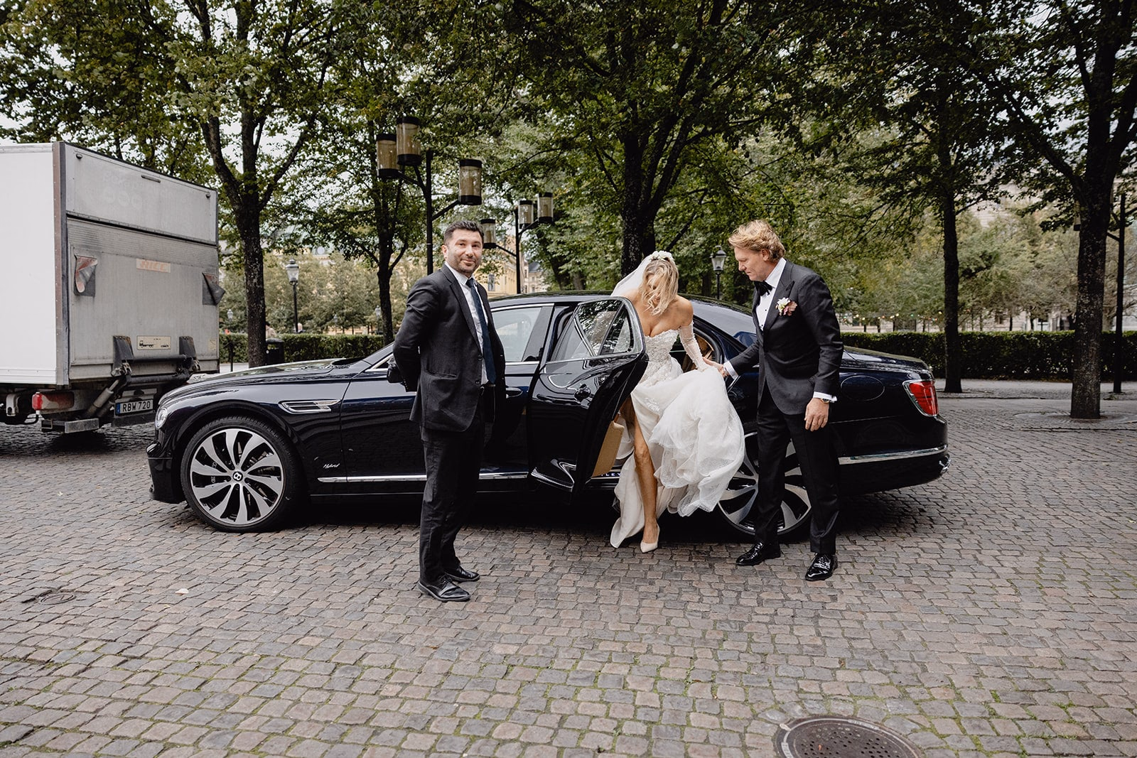 The bride stepping out of a car on arrival at the reception.
