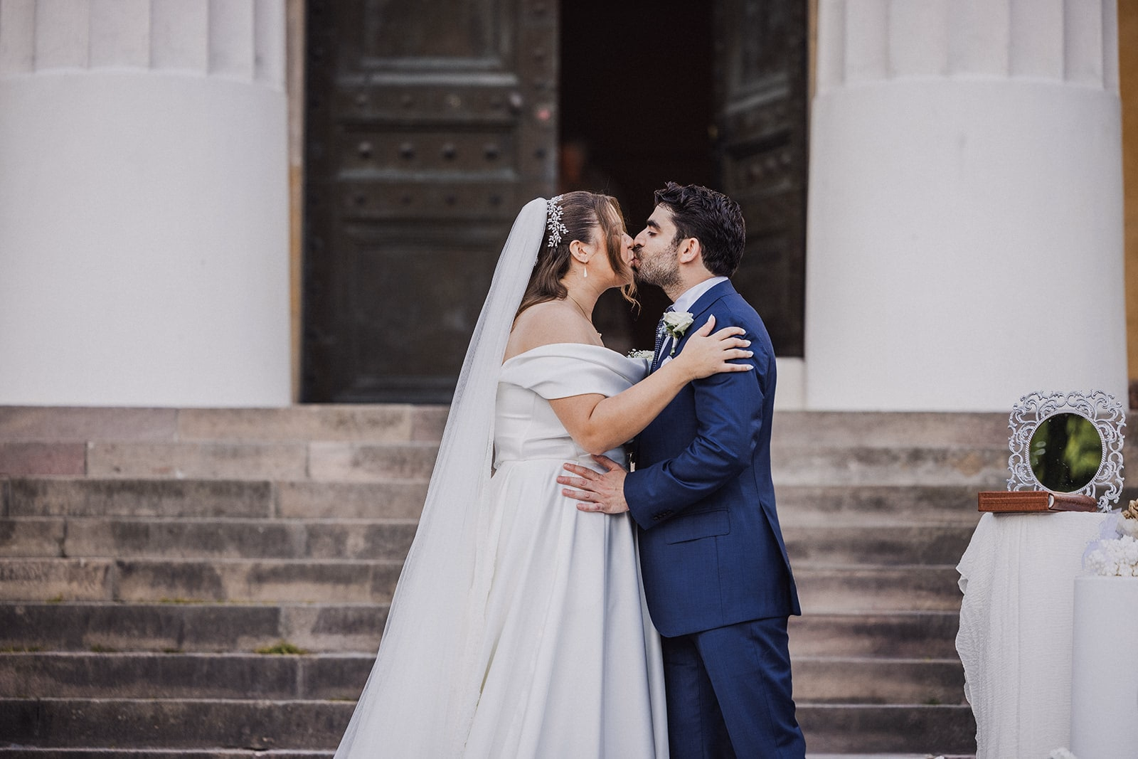 Sara and Kamran kissing at the end of their ceremony.