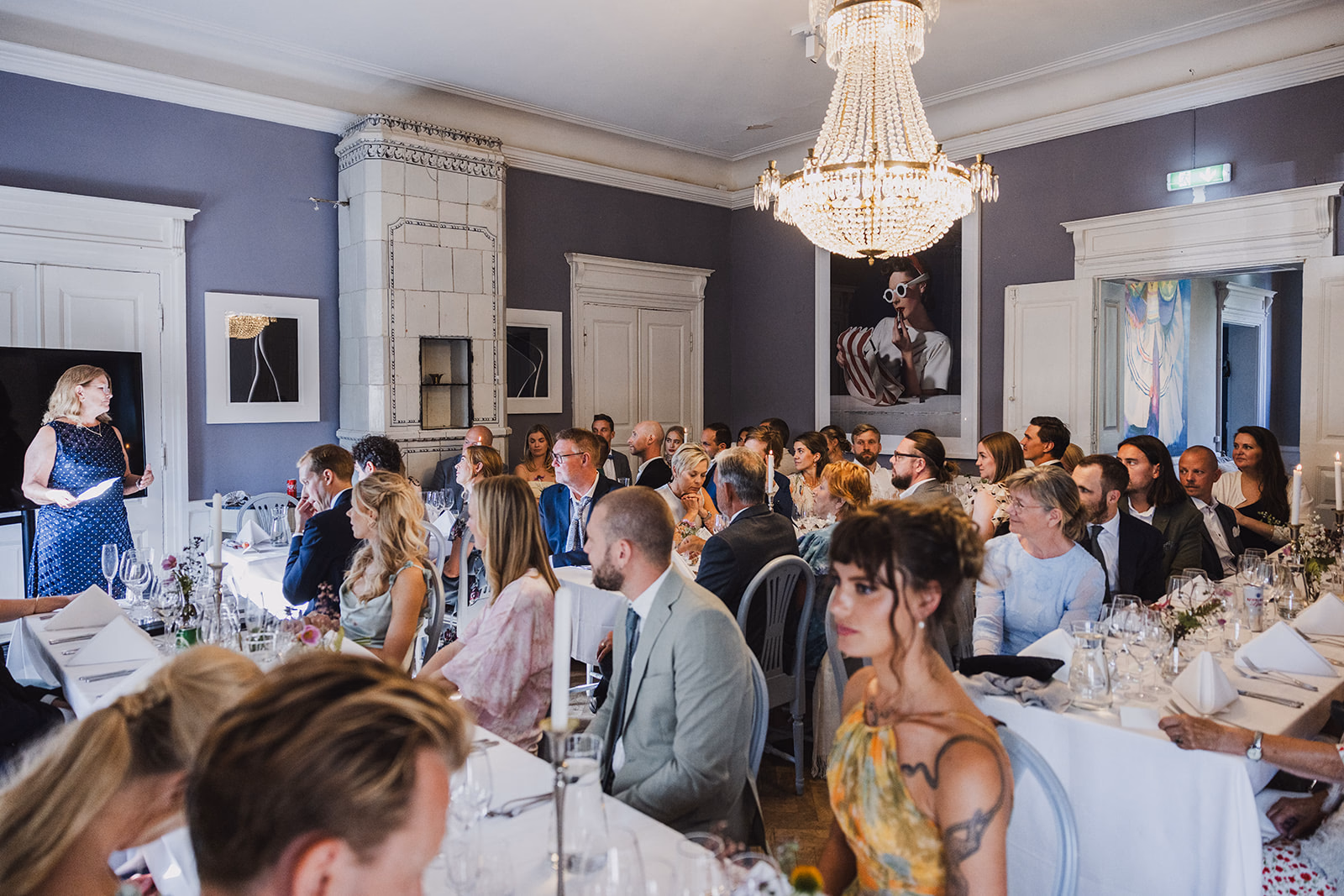 Wedding guests seated together for dinner at Ullvhälls Manor.