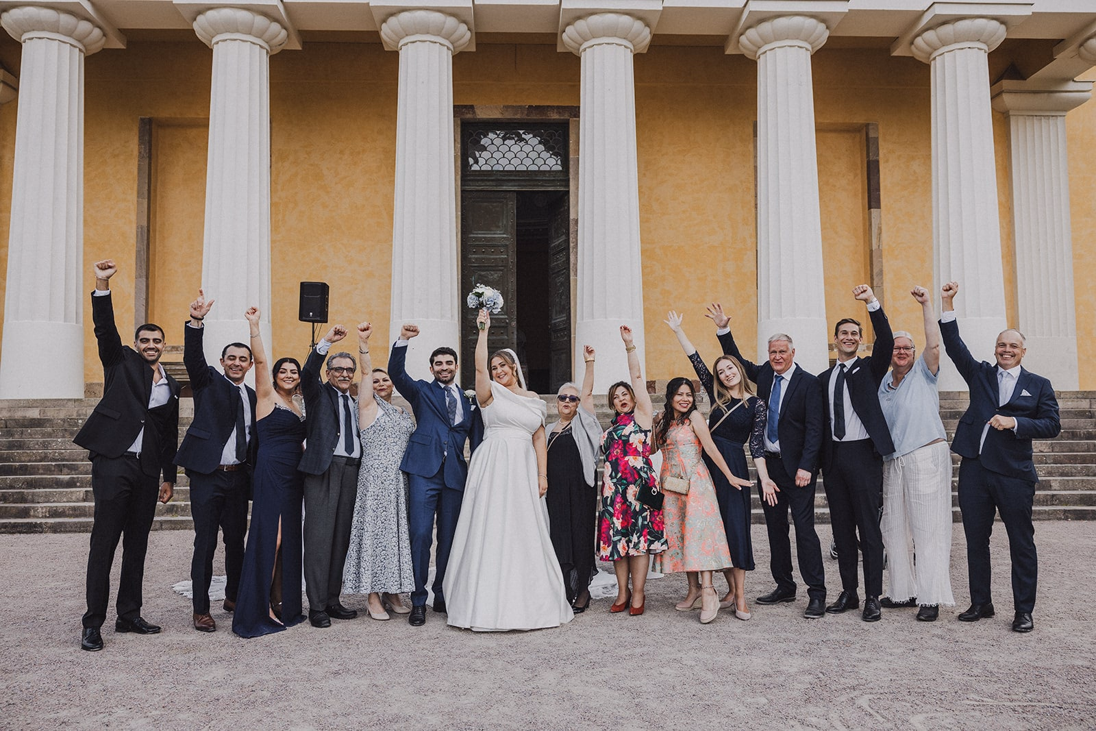The couple and their wedding guests gathered in front of the Linneanum.