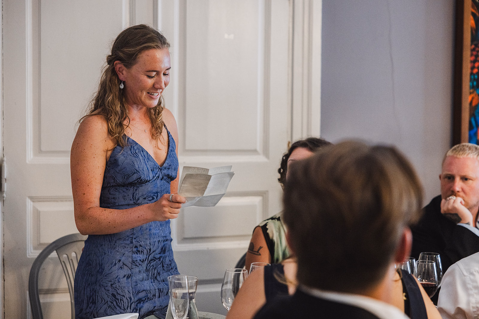 A guest delivering a speech during the wedding dinner.