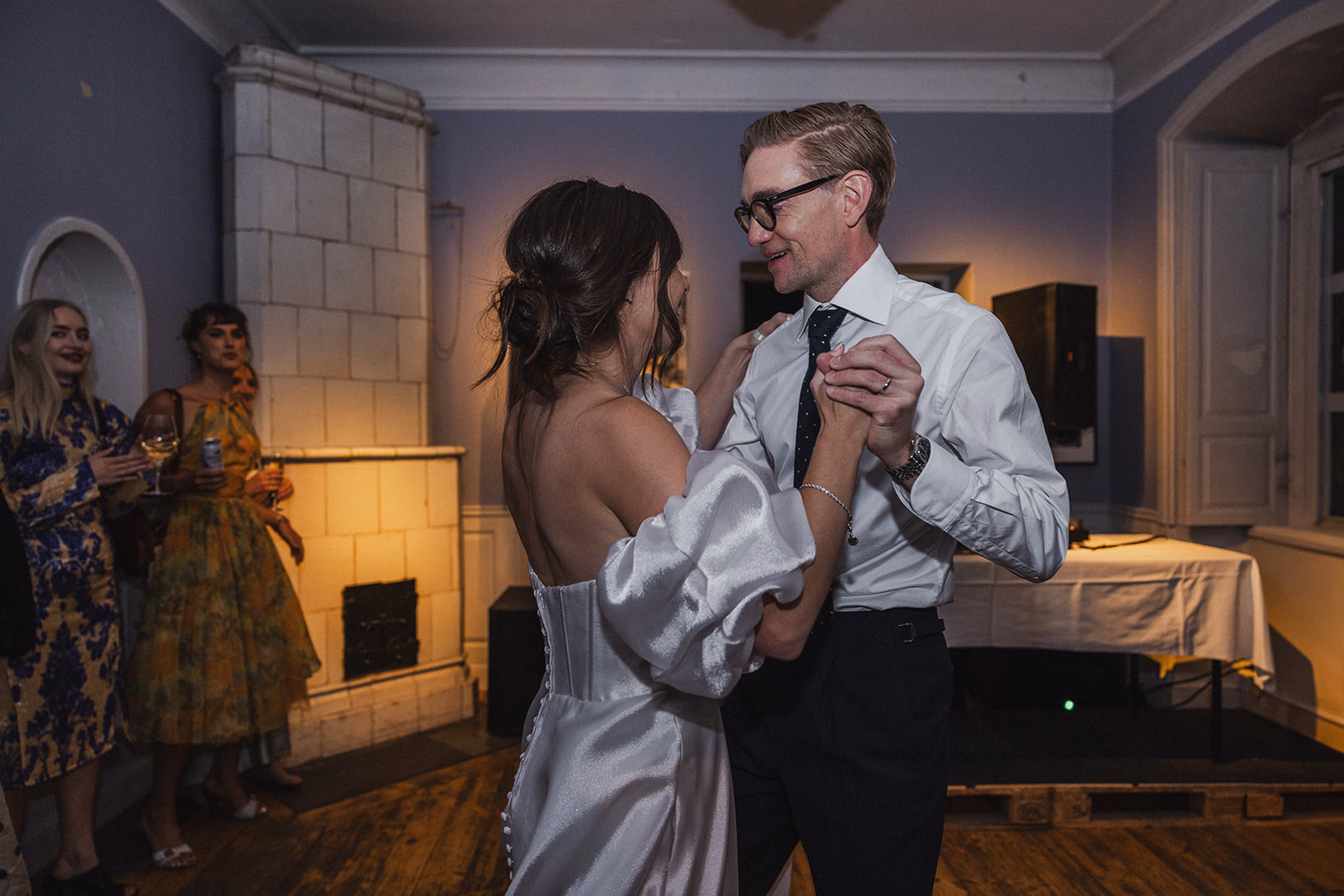 The newlyweds dancing together as the evening party begins.