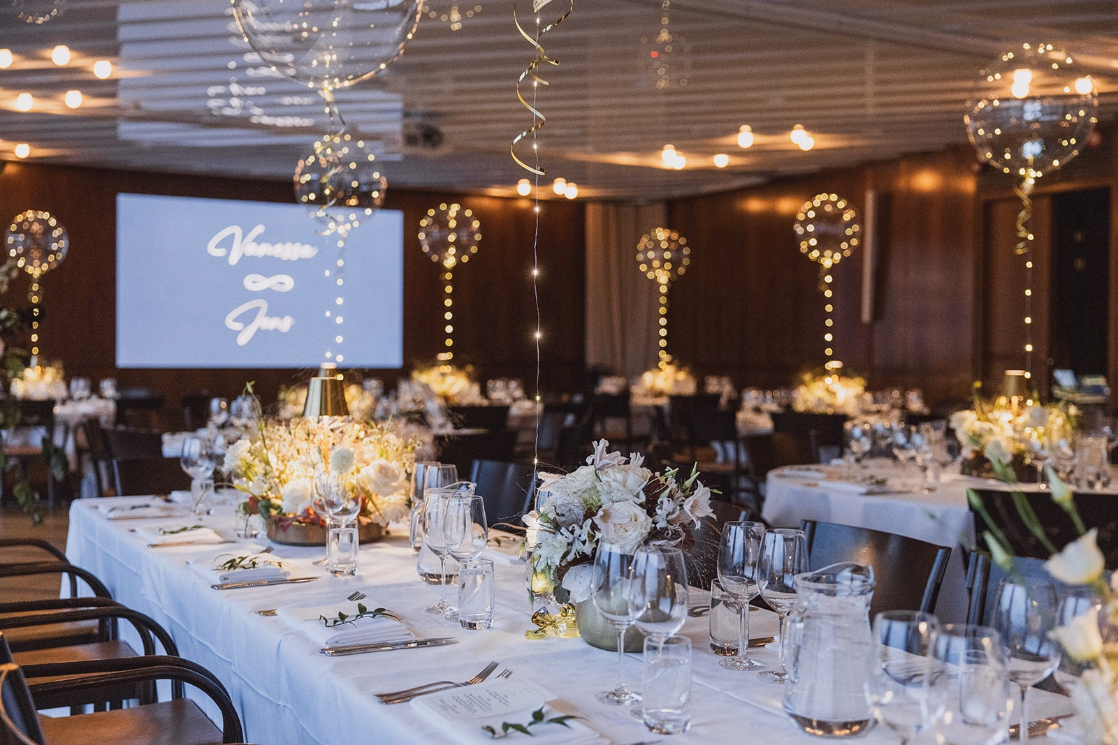 The wedding dinner room prepared with flowers and candlelight at Café Opera.