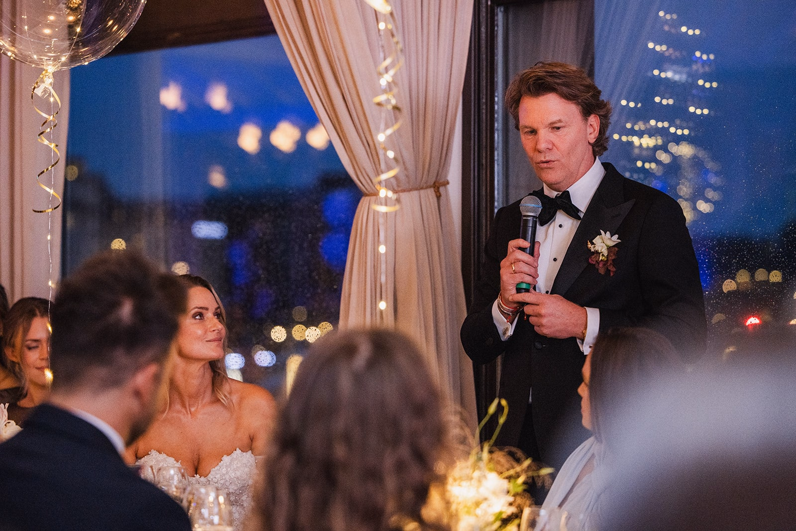 The groom delivering a speech during the wedding dinner.