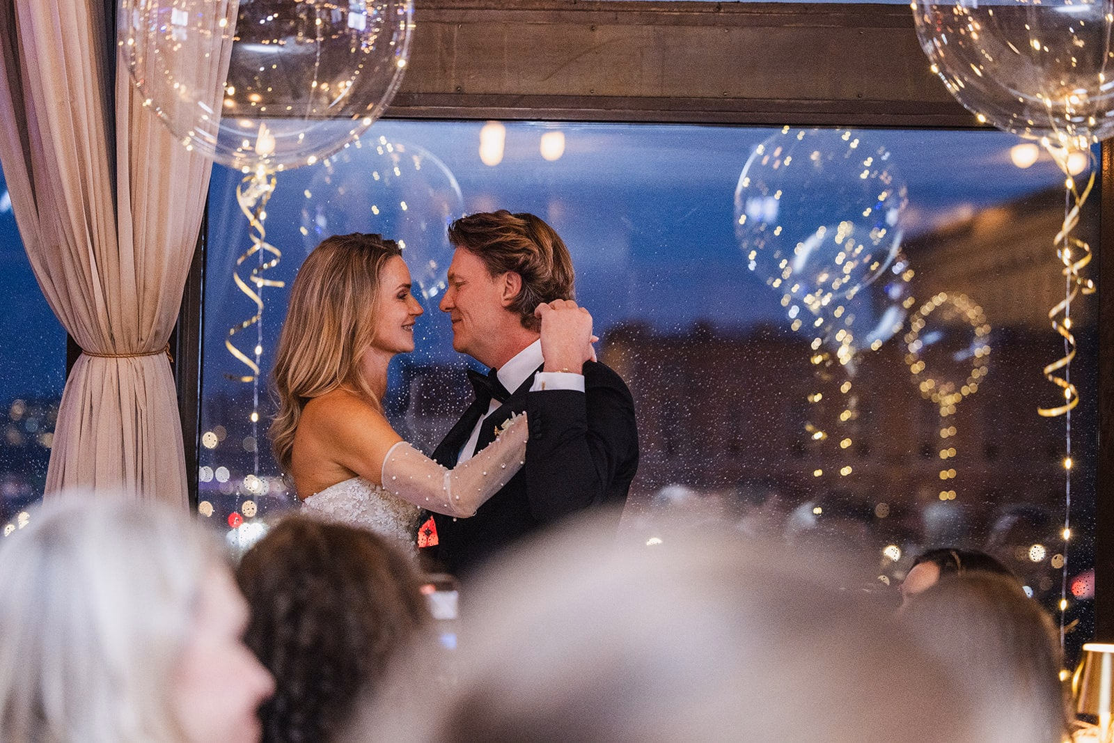 The newlyweds kissing during the dinner speeches.