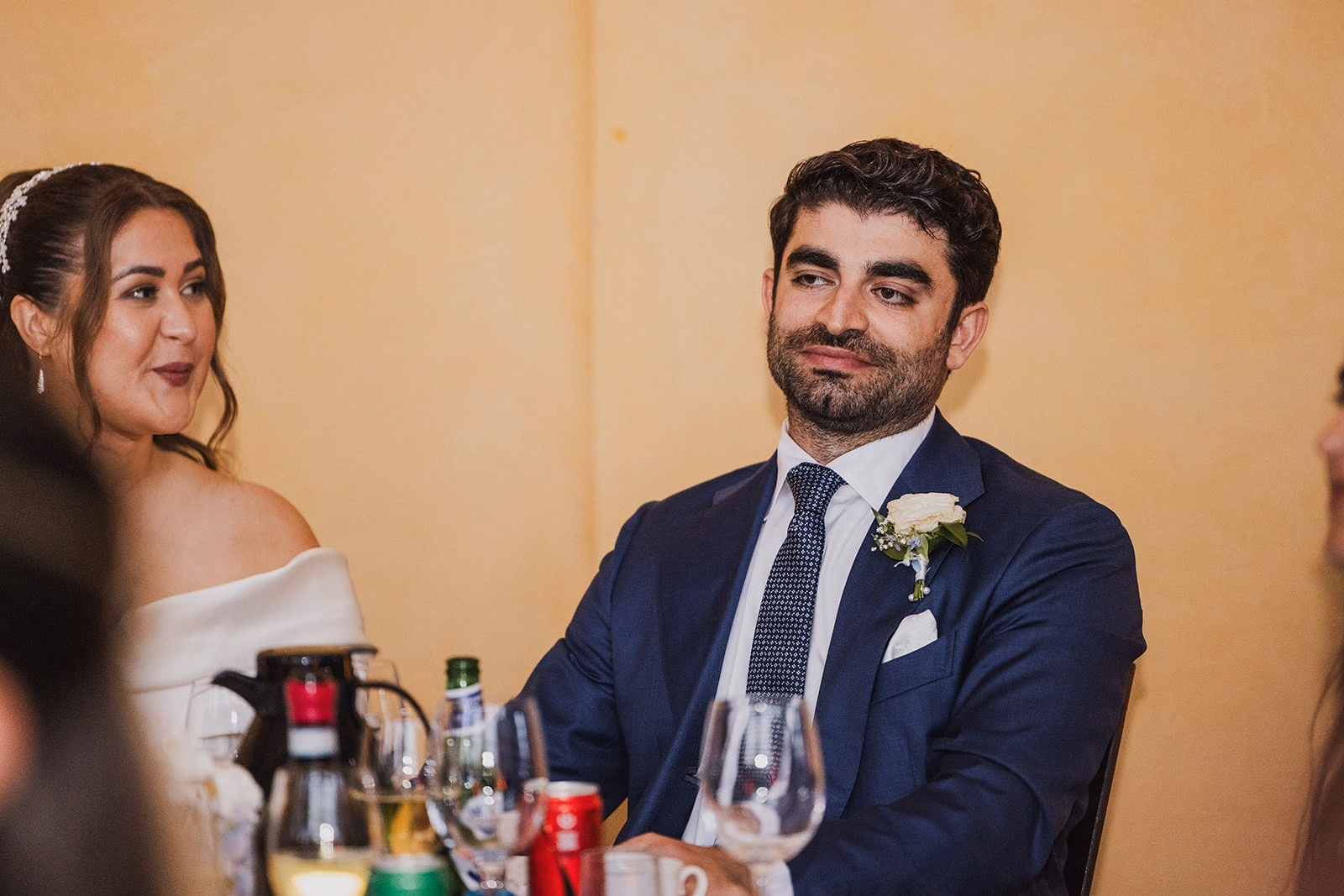 Kamran listening during a wedding speech.