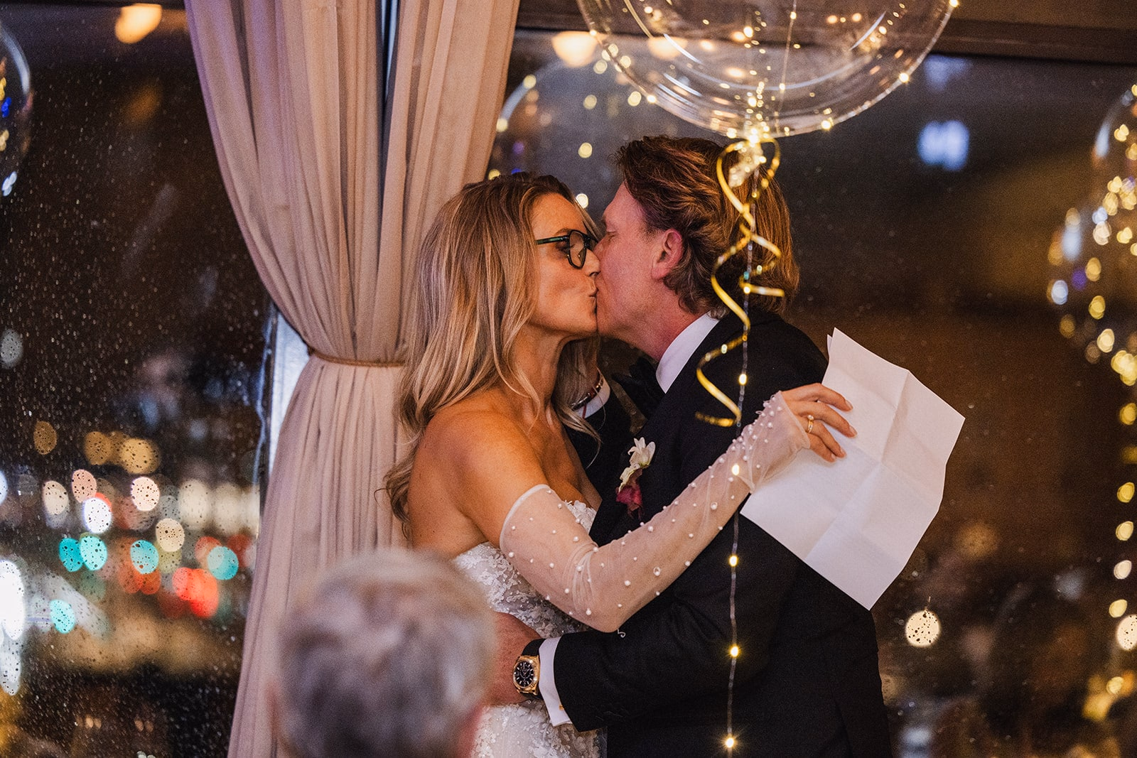 The bride reading from her notes during a wedding speech.