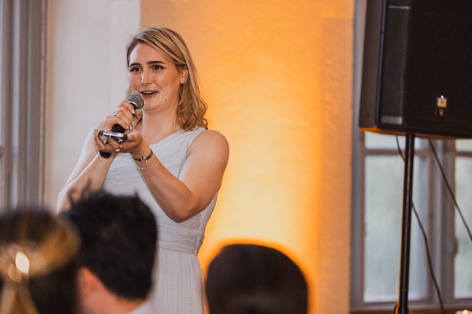 A guest delivering a speech during the wedding dinner.