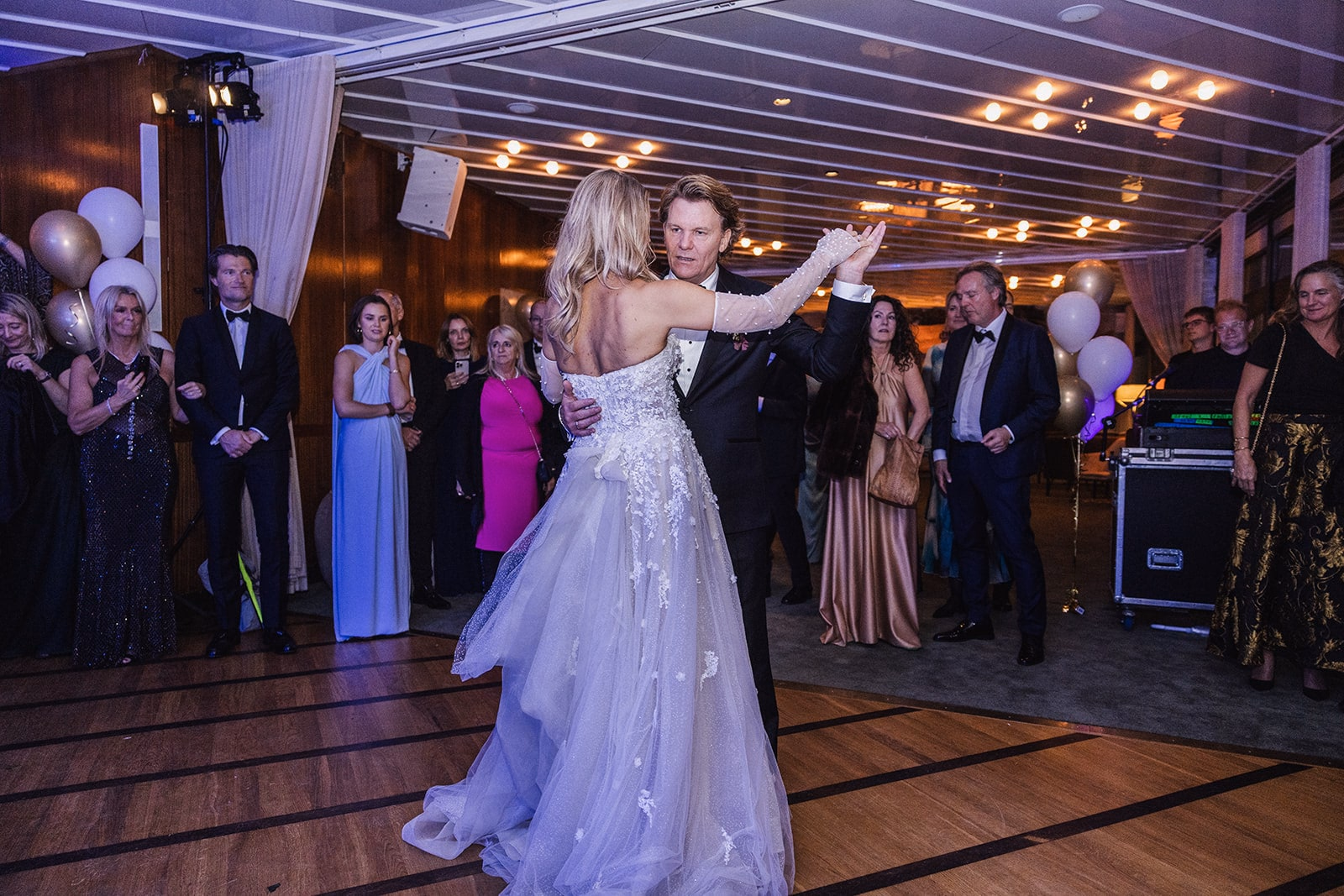 The newlyweds beginning their first dance at Café Opera.