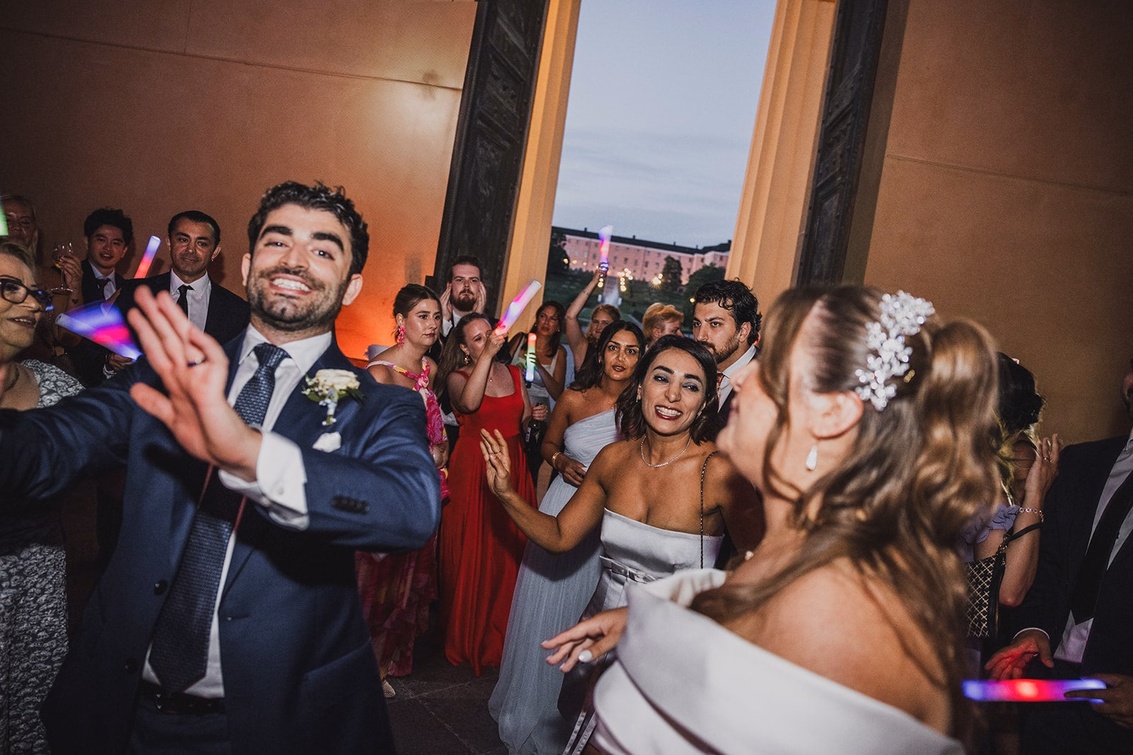 Kamran dancing among the wedding guests.
