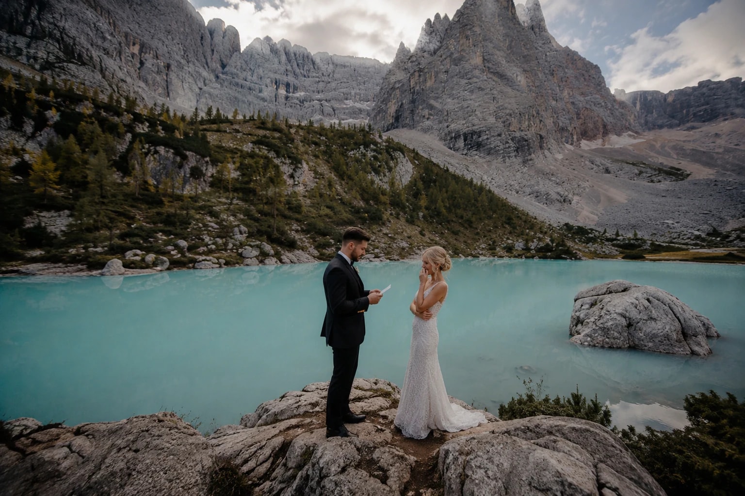 A bride and groom exchanging vows beside Lago di Sorapis near Cortina d'Ampezzo.
