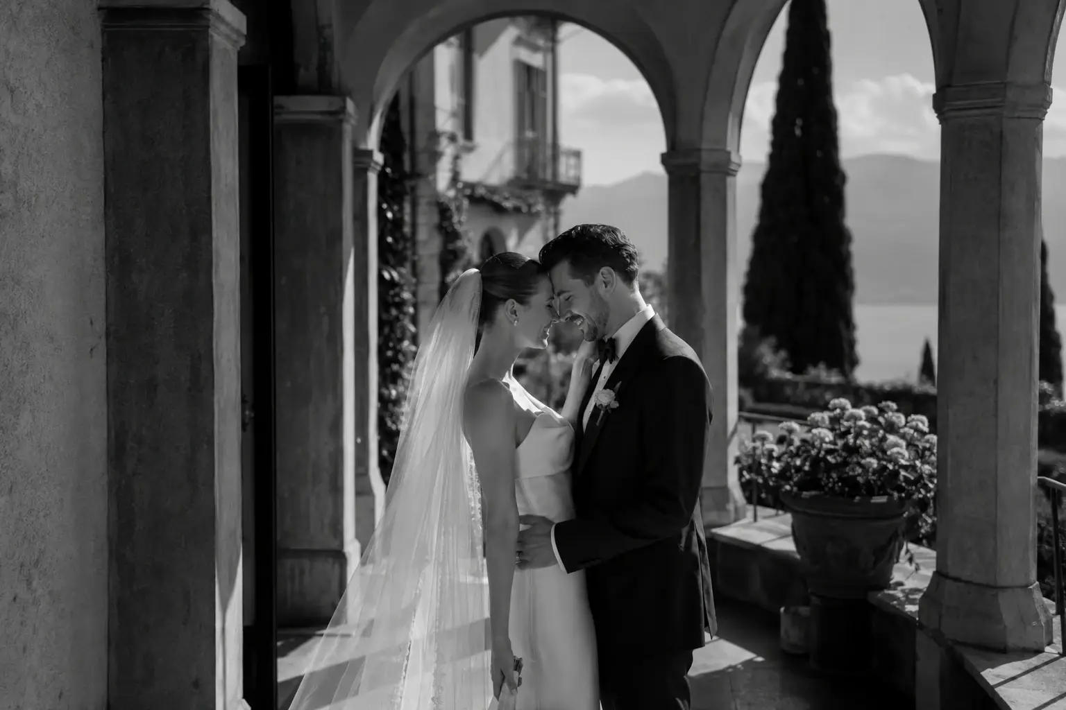 Bride and groom during intimate couple portraits at a luxury Lake Garda wedding overlooking the Italian lake.