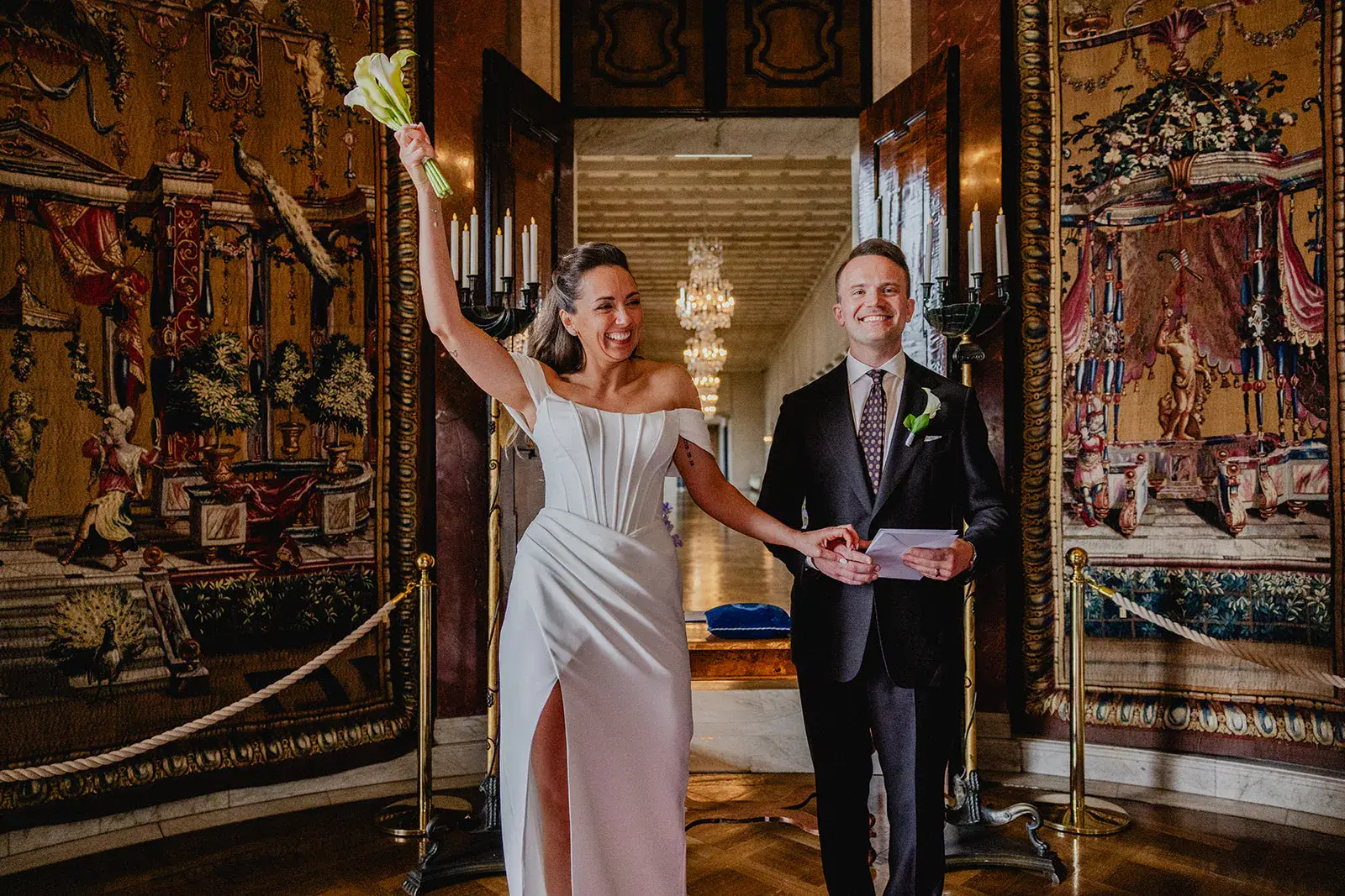 Gintare and Mikael celebrating after their civil wedding inside Stockholm City Hall.